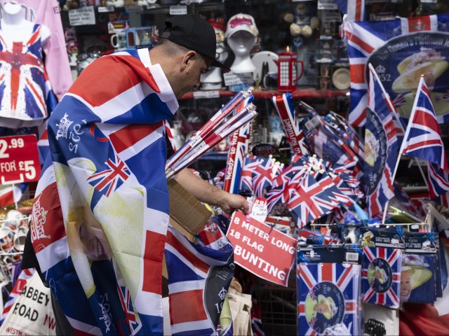 WINDSOR, ENGLAND - MAY 31: A worker prepares a Platinum Jubilee themed display outside a s