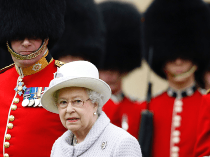 LONDON, ENGLAND - MAY 3: Queen Elizabeth II inspects the guards during a ceremony to present new colours to the 1st Battalion and No. 7 Company the Coldstream Guards at Windsor Castle, on May 3, 2012 in Windsor, England. Queen Elizabeth will celebrate her Diamond Jubilee a month from today. …