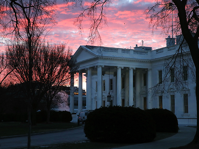 The early morning sun lights up the sky over the White House on January 8, 2018 in Washington, DC. Later today President Donald Trump will travel to Atlanta, Georgia to attend the NCAA National Championship football game with Alabama Crimson Tide playing the Georgia Tech Yellow Jackets. (Photo by Mark …
