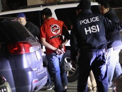 HEMPSTEAD, NY - MARCH 28: U.S. federal agents arrest a suspected gang member late on March 28, 2018 in Hempstead, New York. Overnight and into the morning, U.S. federal agents led by Homeland Security Investigations (HSI) and local police detained suspected gang members across Long Island in a surge of …