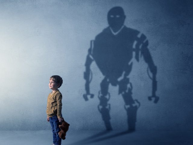 Little boy’s self image appear as a big robotman shadow on his background