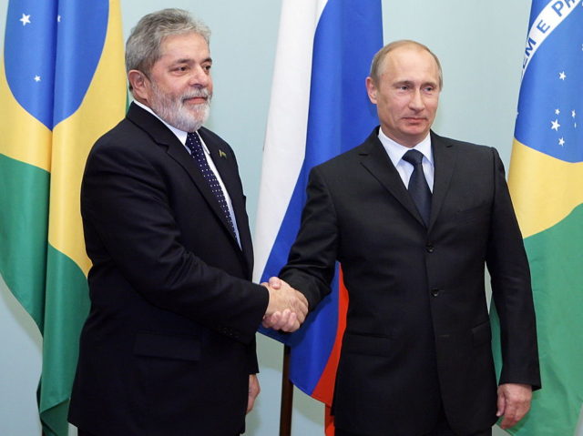 Russian Prime Minister Vladimir Putin (R) greets Brazilian President Luis Inacio Lula da Silva during their meeting on May 14, 2010 in Moscow. AFP PHOTO / ALEXEY DRUZHININ (Photo credit should read ALEXEY DRUZHININ/AFP via Getty Images)