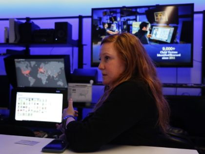 Erin Burke, unit chief for Homeland Security Investigations Child Exploitations Investigations Unit, stands in the victim identification lab where images and video are analyzed and examined to help identify victims of child sex abuse, in Fairfax, Virginia, on Tuesday, March 22, 2022.