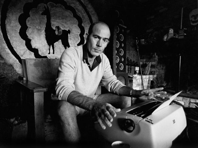Journalist Hunter S. Thompson sits at his typewriter at his ranch circa 1976 near Aspen Colorado. (Photo by Michael Ochs Archives/GettyImages)