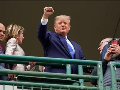 Former President Donald Trump waves to the crowd before the 148th running of the Kentucky