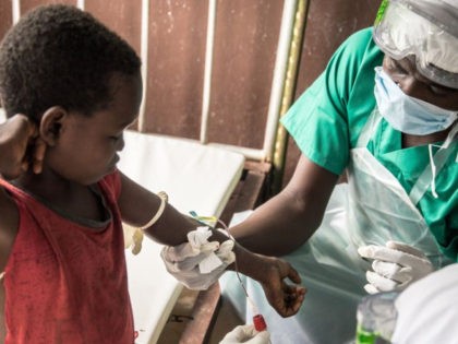 Blood samples are drawn from a boy who didn't display any sign of monkeypox despite his all family has been contaminated, while at a quarantine area of the centre of the International medical NGO Doctors Without Borders (Medecins sans frontieres - MSF), in Zomea Kaka, in the Lobaya region, in …