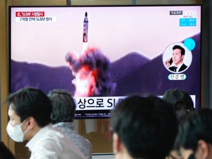 People watch a TV showing a file image of North Korea's missile launch during a news program at the Seoul Railway Station in Seoul, South Korea, Saturday, May 7, 2022. North Korea fired a suspected ballistic missile designed to be launched from a submarine on Saturday, South Korea's military said, …