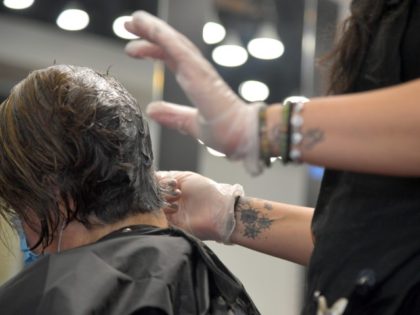 EAST WINDSOR, NEW JERSEY - JUNE 22: A customer gets her hair done at the Anthony Vincent Salon during its reopening after the shutdown of nonessential businesses due to the COVID-19 pandemic on June 22, 2020, in East Windsor, New Jersey. New Jersey Governor Phil Murphy has a multi-stage reopening …