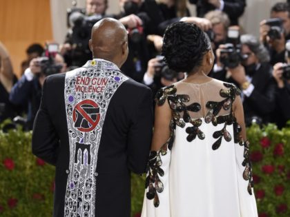 Tracey Collins, right, and New York City mayor Eric Adams, wearing a tuxedo with the words "End Gun Violence," attend The Metropolitan Museum of Art's Costume Institute benefit gala celebrating the opening of the "In America: An Anthology of Fashion" exhibition on Monday, May 2, 2022, in New York.
