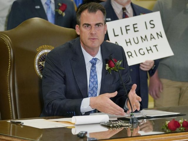 Oklahoma Gov. Kevin Stitt speaks after signing into law a bill making it a felony to perform an abortion, punishable by up to 10 years in prison, on. April 12, 2022, in Oklahoma City. Stitt on Wednesday, May 25 signed into law the nation’s strictest abortion ban, making the state …