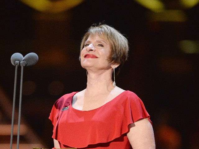 LONDON, ENGLAND - APRIL 08: Patti LuPone presents the award for Best Director on stage during The Olivier Awards with Mastercard at Royal Albert Hall on April 8, 2018 in London, England. (Photo by Jeff Spicer/Getty Images)