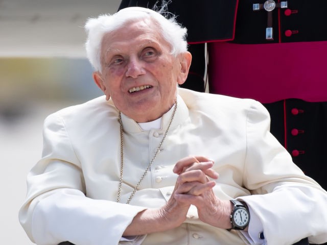 Former pope Benedict XVI poses for a picture at the airport in Munich, southern Germany, b