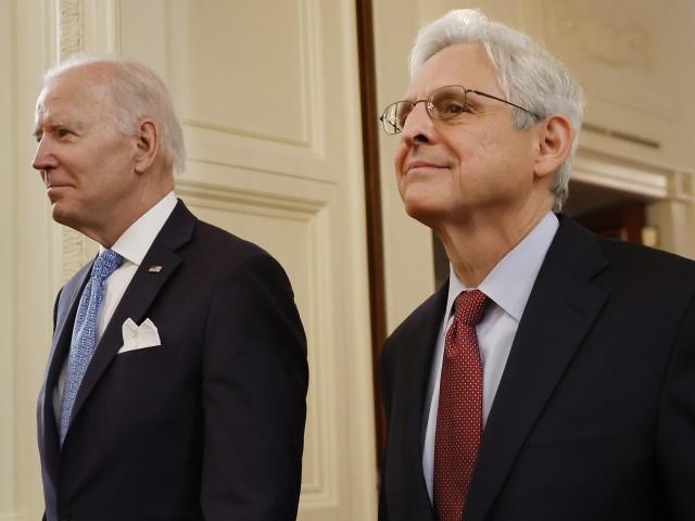 WASHINGTON, DC - MAY 16: U.S. President Joe Biden (L) and Attorney General Merrick Garland walk into the East Room for the Public Safety Officer Medals of Valor ceremony at the White House on May 16, 2022, in Washington, DC. The medals are given for “extraordinary valor above and beyond the call of duty.”