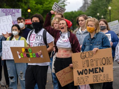 Abortion-rights protesters display placards and shout during a demonstration outside of the U.S. Supreme Court, Sunday, May 8, 2022, in Washington. A draft opinion suggests the U.S. Supreme Court could be poised to overturn the landmark 1973 Roe v. Wade case that legalized abortion nationwide, according to a Politico report …