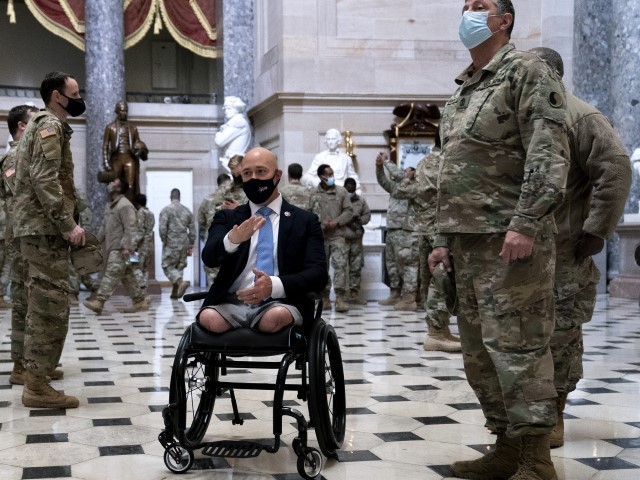 WASHINGTON, DC - JANUARY 13: Rep. Brian Mast (R-FL) (C) gives members of the National Guard a tour of the U.S. Capitol on January 13, 2021 in Washington, DC. The House of Representatives is expected to vote to impeach President Donald Trump later today, after Vice President Mike Pence declined to use the 25th amendment to remove him from office after protestors breached the U.S. Capitol last week. 