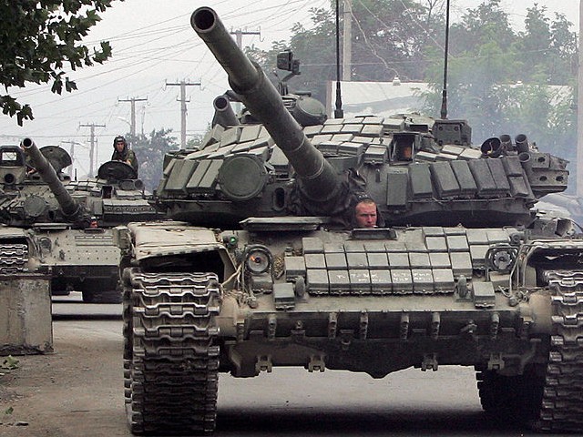 A column of Russian tanks leaves the South Ossetian capital Tskhinvali on August 21, 2008, to the border of Russian Federation. Russia's withdrawal of all its forces from Georgia will be completed on August 22, Defence Minister Anatoly Serdyukov announced on August 21, quoted by the Interfax news agency. AFP PHOTO/ KAZBEK BASAEV (Photo credit should read KAZBEK BASAEV/AFP via Getty Images)