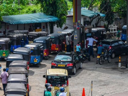 Motorists queue up to buy fuel at a Ceylon Petroleum Corporation fuel station in Colombo o