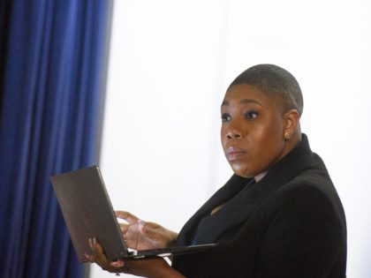Senior Advisor and Chief Spokesperson for the Vice President, Symone Sanders, is seen before US Vice President Kamala Harris takes part in a virtual roundtable discussion on the 'digital divide' and high-speed internet access in the South Court Auditorium of the Eisenhower Executive Office Building, next to the White House …