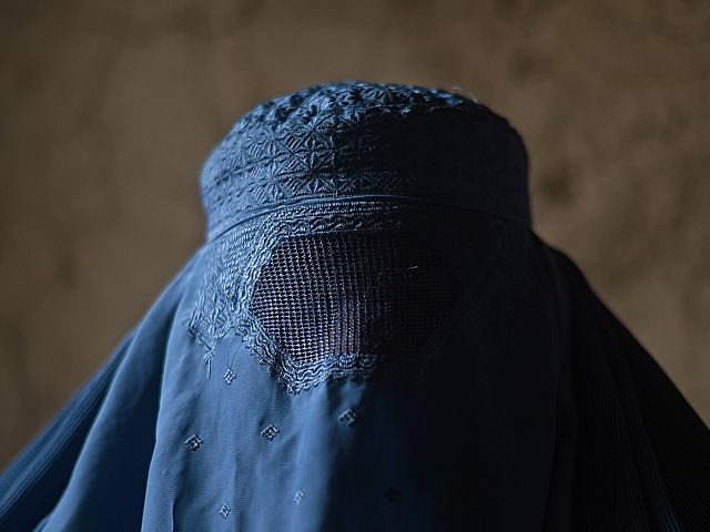 An internally displaced Afghan woman waits to receive food relief aid from the World Food Programme (WFP) in Kabul on January 13, 2015. The UN says about 782,000 people have been displaced by decades of conflict in Afghanistan.More than 130,000 individuals were recorded as newly displaced in 2014, the last …