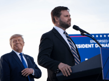 DELAWARE, OH - APRIL 23: (L-R) Former President Donald Trump listens as J.D. Vance, a Republican candidate for U.S. Senate in Ohio, speaks during a rally hosted by the former president at the Delaware County Fairgrounds on April 23, 2022 in Delaware, Ohio. Last week, Trump announced his endorsement of …