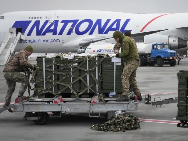 Ukraine Tensions US Ukrainian servicemen unpack shipment of military aid delivered as part of the United States of America's security assistance to Ukraine, at the Boryspil airport, outside Kyiv, Ukraine, Friday, Feb. 11, 2022. British Prime Minister Boris Johnson said Thursday the Ukraine crisis has grown into "the most dangerous moment" for Europe in decades, while his top diplomat held icy talks with her Moscow counterpart who said the Kremlin won't accept lectures from the West.
