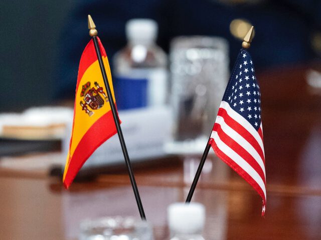 The flags of Spain and the U.S. are seen on the table during a meeting of Spanish Defense Minister Margarita Robles and Secretary of Defense Lloyd Austin at the Pentagon, Thursday, May 19, 2022, in Washington. (AP Photo/Alex Brandon)