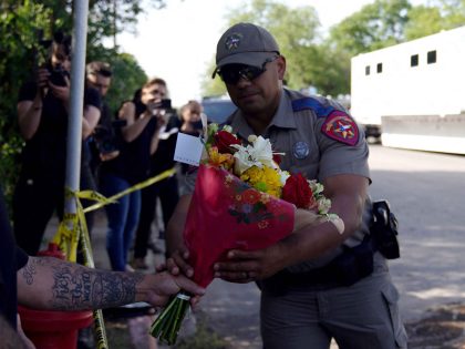 Uvalde officer flowers (Allison Dinner / AFP / Getty)