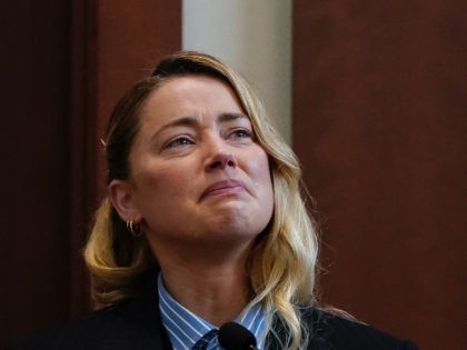 Actor Amber Heard testifies in the courtroom at the Fairfax County Circuit Court in Fairfax, Va., Wednesday May 4, 2022. Actor Johnny Depp sued his ex-wife Heard for libel in Fairfax County Circuit Court after she wrote an op-ed piece in The Washington Post in 2018 referring to herself as …