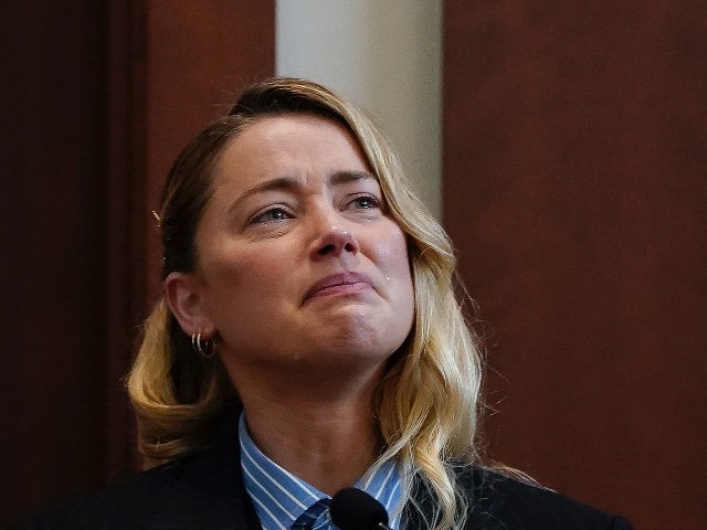Actor Amber Heard testifies in the courtroom at the Fairfax County Circuit Court in Fairfax, Va., Wednesday May 4, 2022. Actor Johnny Depp sued his ex-wife Heard for libel in Fairfax County Circuit Court after she wrote an op-ed piece in The Washington Post in 2018 referring to herself as …
