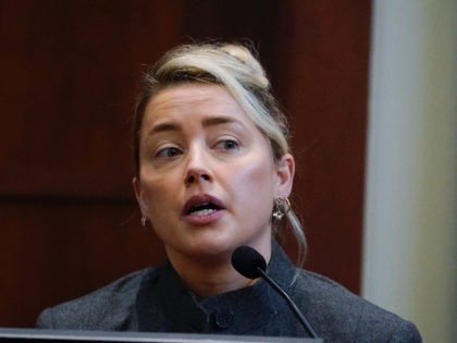 Actor Amber Heard testifies in the courtroom at the Fairfax County Circuit Courthouse in F