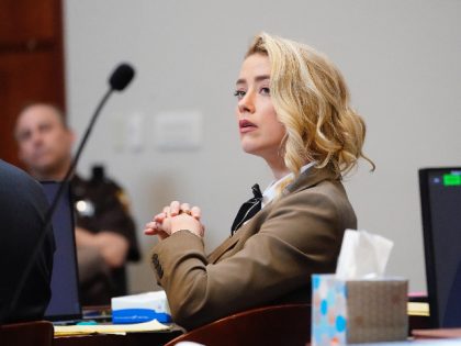 Actor Amber Heard listens in the courtroom at the Fairfax County Circuit Courthouse in Fai
