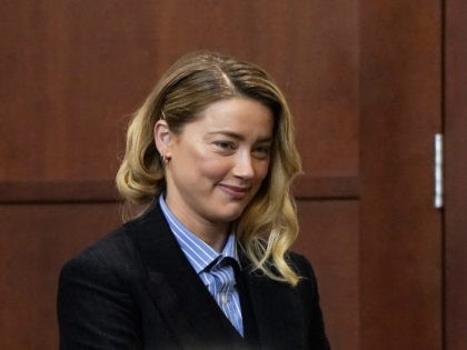 US actress Amber Heard arrives at the Fairfax County Circuit Court during a defamation case against her by ex-husband, US actor Johnny Depp, in Fairfax, Virginia, on May 4, 2022. - US actor Johnny Depp sued his ex-wife Amber Heard for libel in Fairfax County Circuit Court after she wrote …
