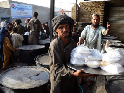 Volunteers prepare food to give as donation to the poor from the Afterlife foundation during Islam's Holy fasting month of Ramadan in Kandahar on April 27, 2022. (Photo by Javed TANVEER / AFP) (Photo by JAVED TANVEER/AFP via Getty Images)