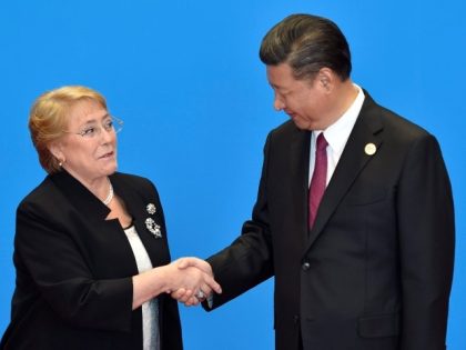 BEIJING, CHINA - MAY 15: Chile's President Michelle Bachelet (L) shakes hands with Chinese
