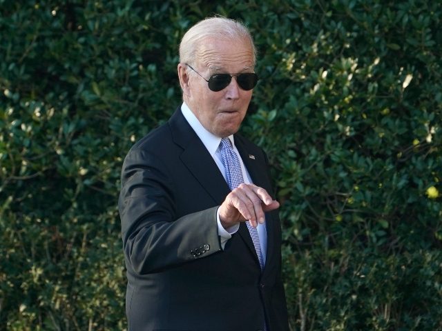 President Joe Biden points out someone in the audience as he arrives for an event to welcome the Milwaukee Bucks basketball team to the White House to celebrate their 2021 NBA Championship, on the South Lawn of the White House in Washington, Monday, Nov. 8, 2021. (AP Photo/Susan Walsh)