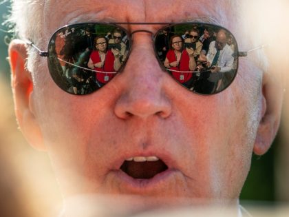 NBC Senior White House Correspondent Kelly O'Donnell, Reuters White House Reporter Steve Holland, right, and other members of the media are visible in the sunglasses of President Joe Biden as he speaks on the South Lawn of the White House in Washington, Monday, May 30, 2022, after returning from Wilmington, …