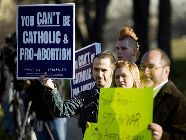 Pro-life activists demonstrate outside outside of a Catholic mass attended by House Speaker Nancy Pelosi on January 3, 2007, in Washington, DC. (Brendan Smialowski/Getty Images)