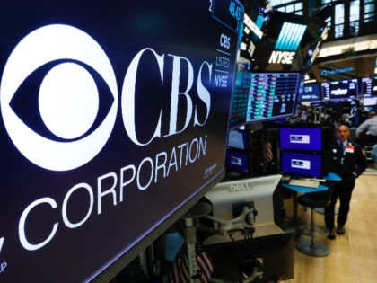 The logo for the CBS Corporation appears above a trading post on the floor of the New York Stock Exchange, Tuesday, Aug. 13, 2019. CBS and Viacom said Tuesday they will reunite, bringing together their networks and the Paramount movie studio as traditional media giants bulk up to challenge streaming …