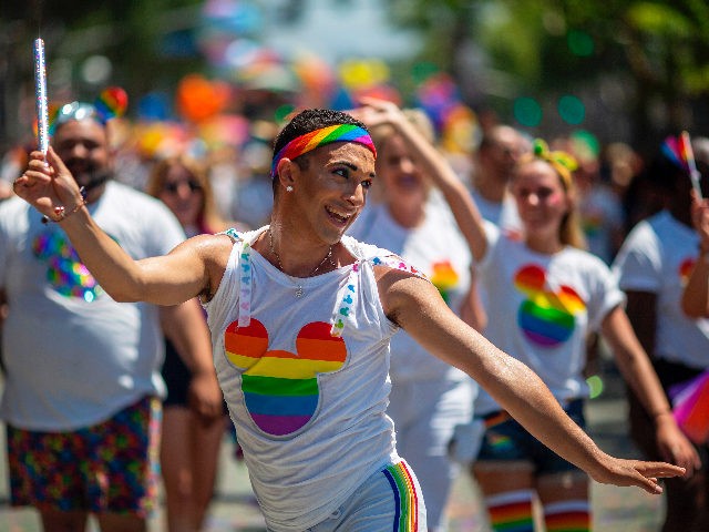 People from the Walt Disney Company participate in the annual LA Pride Parade in West Holl