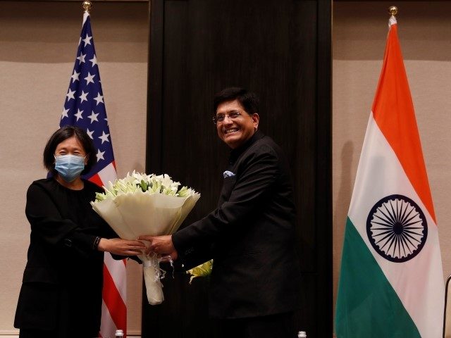 India's Minister of Commerce and Industry, Piyush Goyal, presents a bouquet to U.S. Trade