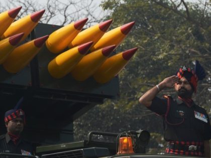 Indian military personnel ride alongside missiles displayed during a parade to mark Republic Day in Kolkata on January 26, 2016. Celebrations are underway across India as the country marks its 67th Republic Day. AFP PHOTO / DIBYANGSHU SARKAR / AFP / DIBYANGSHU SARKAR (Photo credit should read DIBYANGSHU SARKAR/AFP via …
