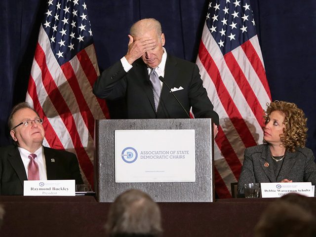 WASHINGTON, DC - FEBRUARY 27: U.S. Vice President Joe Biden feigns disappointment while delivering remarks during the Democratic National Committee's Winter Meeting with (L-R) DNC Vice President Mike Tate, DNC President Raymond Buckley, DNC Chair Rep. Debbie Wasserman Schultz (D-FL) and DNC Secretary Yvette Lewis at the Capitol Hilton February …