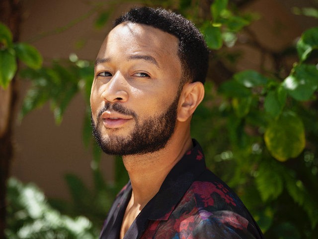 In this June 13, 2020 photo, singer-songwriter John Legend appears during a photo session