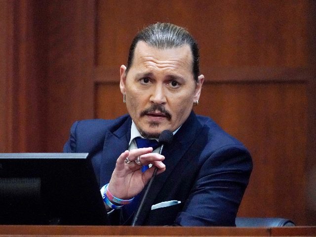 Actor Johnny Depp testifies in the courtroom at the Fairfax County Circuit Courthouse in Fairfax, Virginia, April 25, 2022. - Actor Johnny Depp sued his ex-wife Amber Heard for libel in Fairfax County Circuit Court after she wrote an op-ed piece in The Washington Post in 2018 referring to herself …