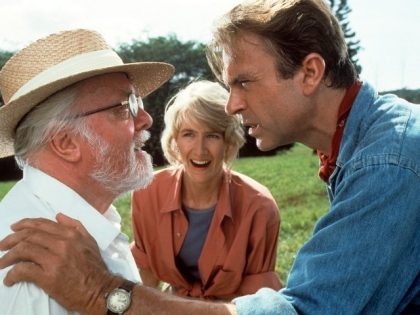 Richard Attenborough, Laura Dern and Sam Neill watch a hatching in a scene from the film 'Jurassic Park', 1993. (Photo by Universal/Getty Images)