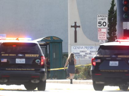 LAGUNA WOODS, CALIFORNIA - MAY 15: Police vehicles are parked near the scene of a shooting at the Geneva Presbyterian Church on May 15, 2022 in Laguna Woods, California. According to police, the shooting left one person dead, four critically wounded, and one with minor injuries. (Photo by Mario Tama/Getty …