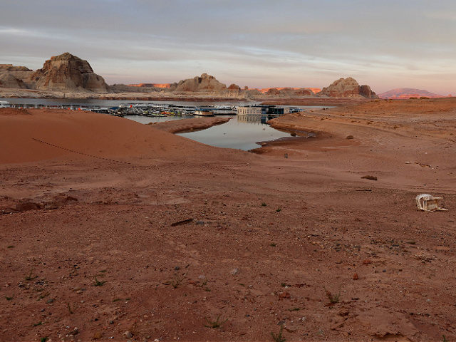 BIG WATER, UTAH - MARCH 27: Low water levels are visible at the Wahweap Boat Rental marina at Lake Powell on March 27, 2022 in Big Water, Utah. As severe drought grips parts of the Western United States, water levels at Lake Powell dropped to their lowest level since the …