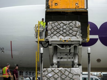 DULLES, VA - MAY 25: Pallets of baby formula are unloaded from a FedEx cargo plane upon ar