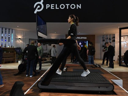 LAS VEGAS, NV - JANUARY 11: Maggie Lu uses a Peloton Tread treadmill during CES 2018 at the Las Vegas Convention Center on January 11, 2018 in Las Vegas, Nevada. The USD 3,995 workout machine is expected to be available later this year and features a 32-inch touch screen that …