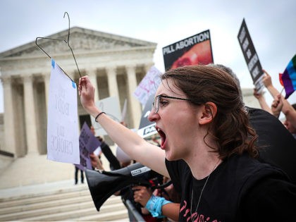 WASHINGTON, DC - MAY 03: Pro-choice and anti-abortion activists confront one another in front of the U.S. Supreme Court Building on May 03, 2022 in Washington, DC. In a leaked initial draft majority opinion obtained by Politico, and authenticated by Chief Justice John Roberts, Supreme Court Justice Samuel Alito wrote …